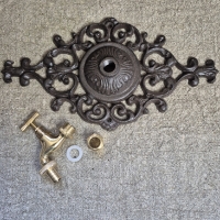 Gietijzeren ornament muurkraan