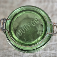 Oude groene glazen weckpot